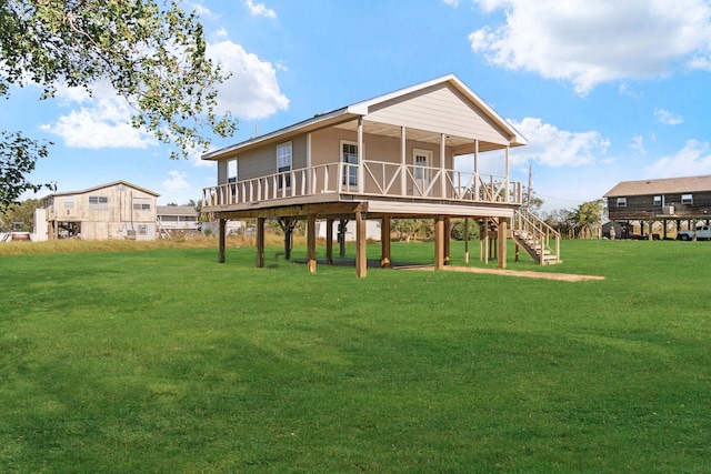 rear view of house with a lawn