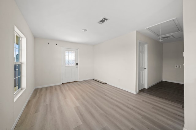 unfurnished room with light wood-type flooring