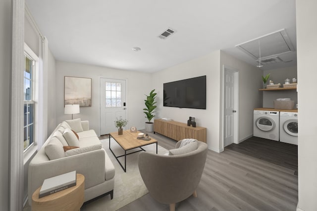 living room featuring hardwood / wood-style floors and washer and clothes dryer