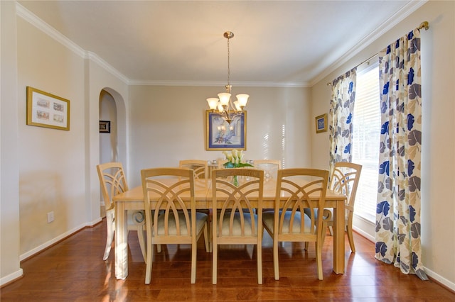 dining space with crown molding, arched walkways, and dark wood-style flooring