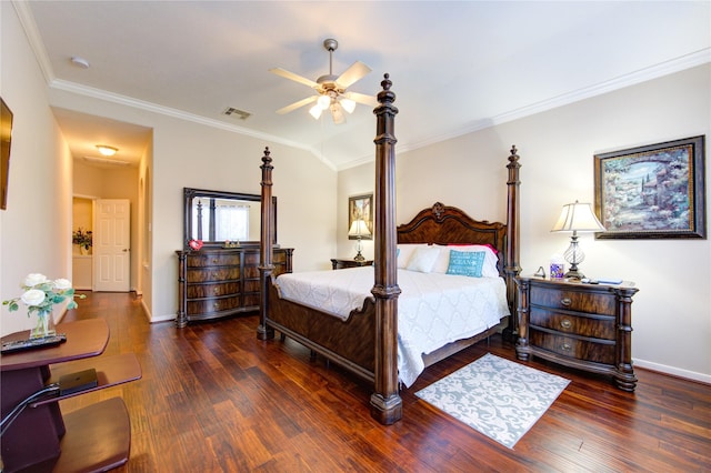 bedroom featuring dark wood-style floors, baseboards, visible vents, and crown molding