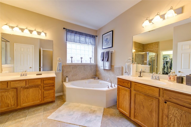 full bathroom with tile patterned flooring, two vanities, a sink, and a shower stall