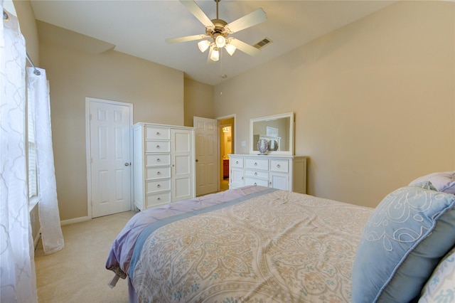 bedroom featuring light carpet, a ceiling fan, visible vents, and baseboards