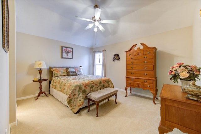 bedroom featuring a ceiling fan, light colored carpet, and baseboards