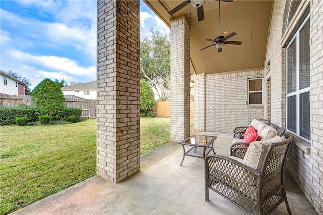 view of patio with a fenced backyard, an outdoor hangout area, and a ceiling fan