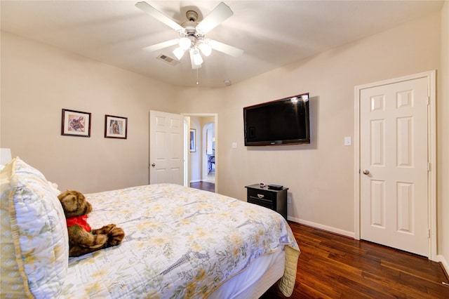 bedroom with ceiling fan, dark wood-style flooring, visible vents, and baseboards