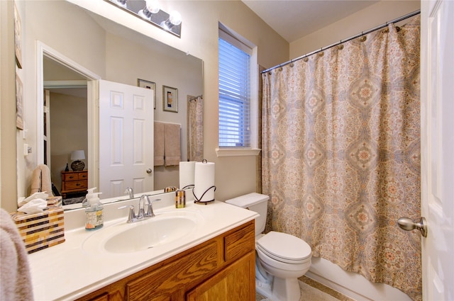 full bathroom featuring vanity, toilet, and shower / tub combo with curtain