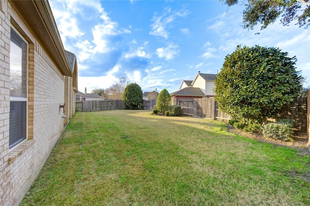 view of yard with a fenced backyard