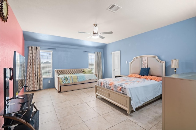 bedroom featuring light tile patterned flooring and ceiling fan
