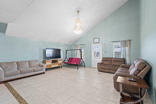 tiled living room with a notable chandelier and high vaulted ceiling