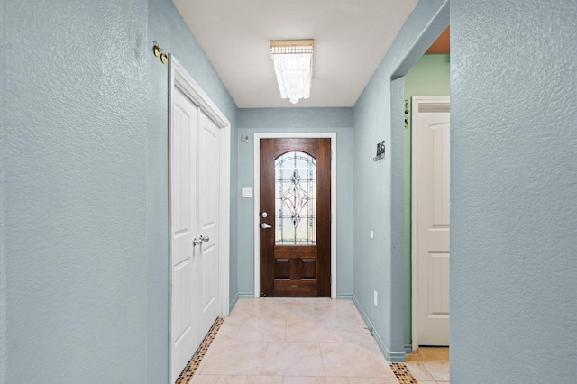 doorway featuring light tile patterned floors