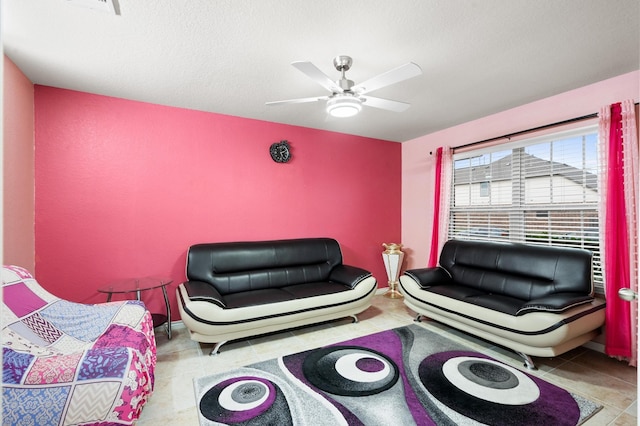 tiled living room with ceiling fan