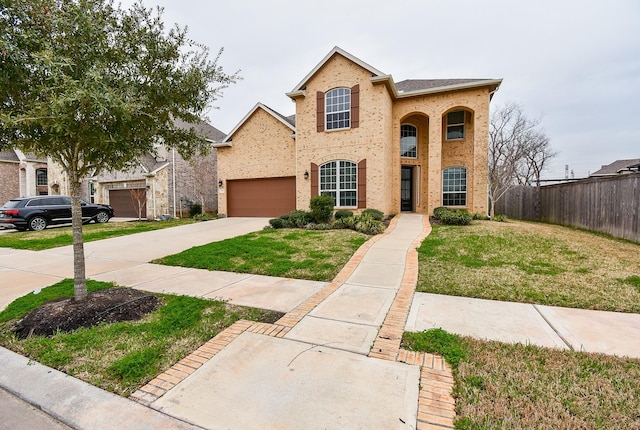 view of front facade featuring a garage and a front yard