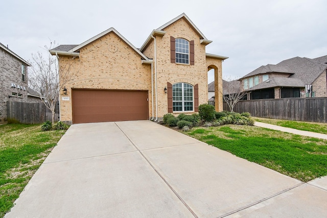 view of front facade with a garage and a front yard