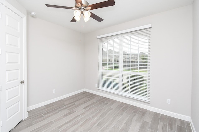 unfurnished room with ceiling fan