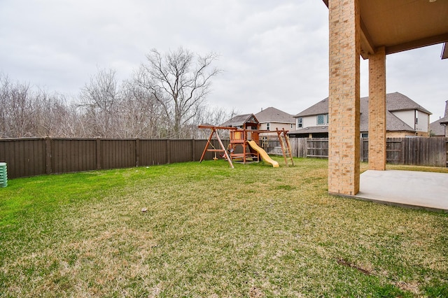 view of yard with a playground and a patio