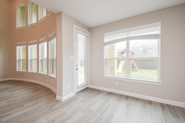 spare room featuring light hardwood / wood-style flooring