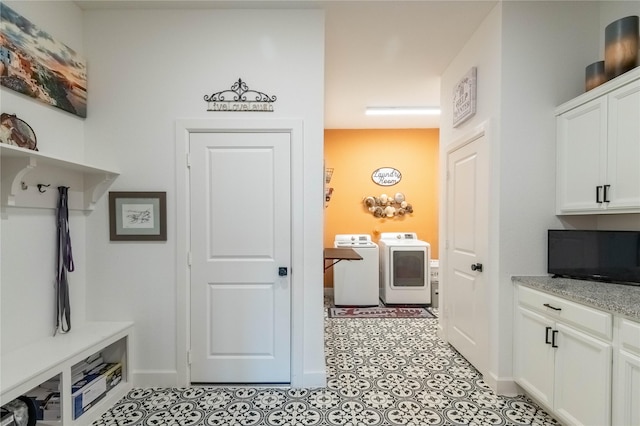 mudroom featuring separate washer and dryer