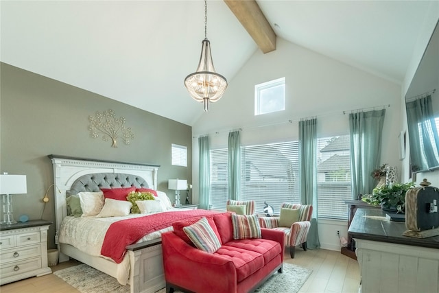 bedroom with multiple windows, light wood-type flooring, and beam ceiling