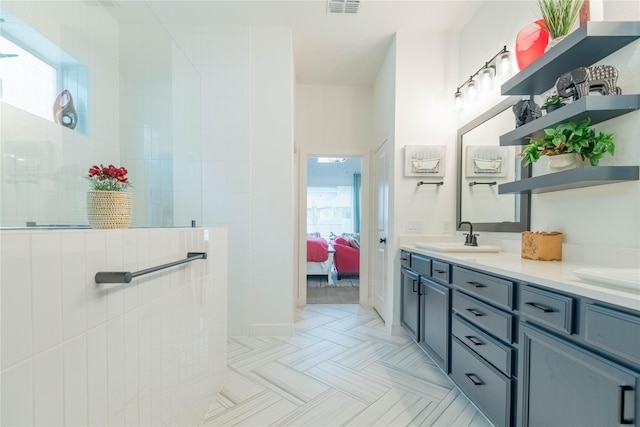 bathroom featuring vanity and walk in shower