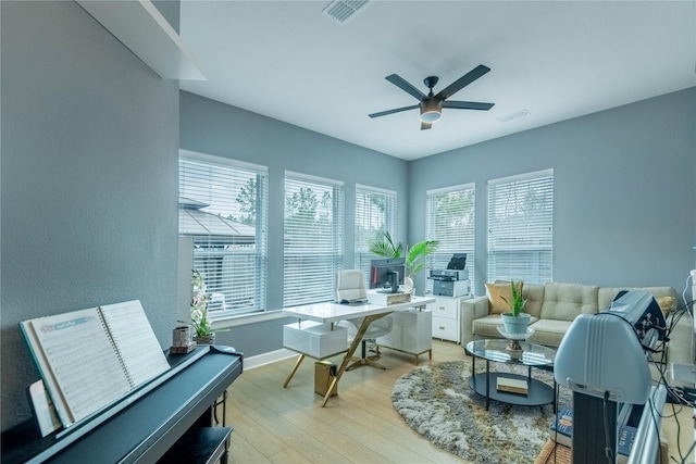 interior space featuring light wood-type flooring and ceiling fan