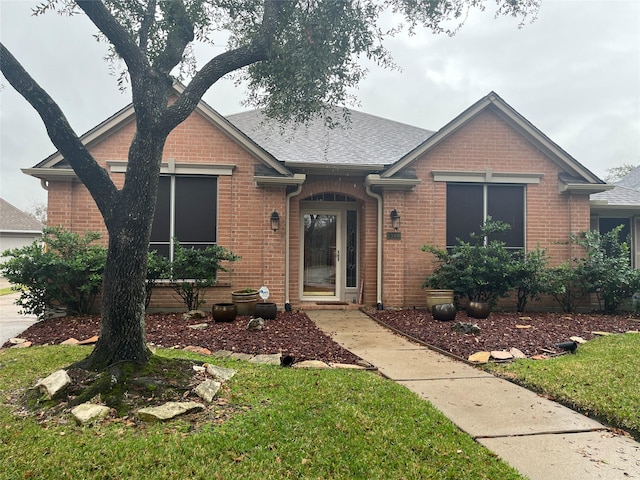 ranch-style house with brick siding