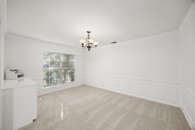 spare room with a chandelier, visible vents, and ornamental molding