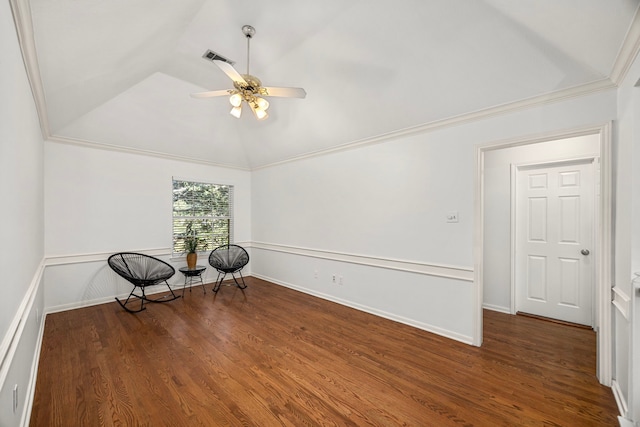 unfurnished room featuring dark wood-type flooring, vaulted ceiling, ornamental molding, and ceiling fan