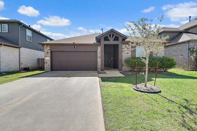 view of front of house with a garage and a front yard