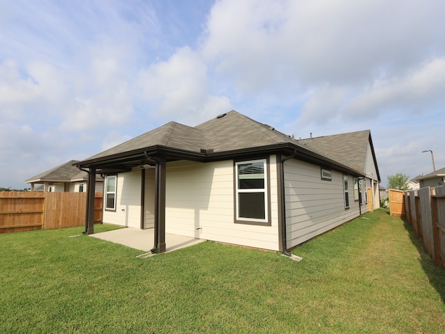9811 Robard Ridge Ct, Montgomery, TX 77316 - rear view of house featuring a patio and a shingled roof