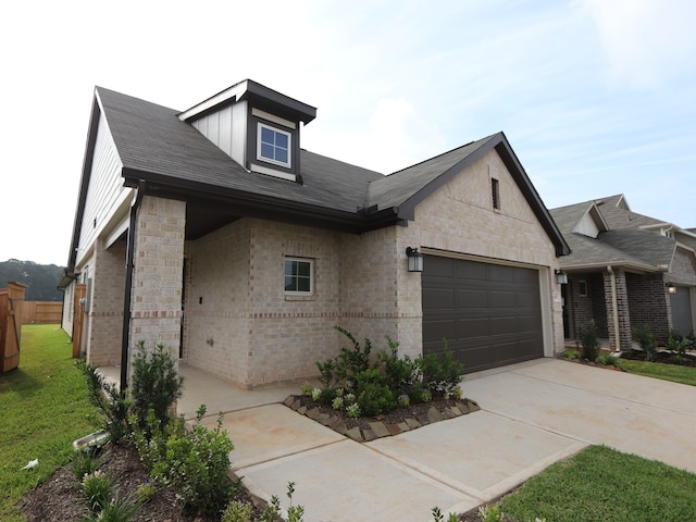 9811 Robard Ridge Ct, Montgomery, TX 77316 - view of front of property with brick siding, an attached garage, driveway, and roof with shingles