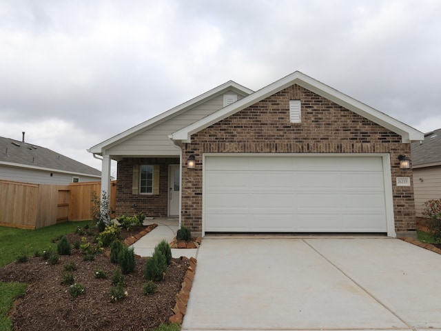 26235 Astral Way, La Marque, TX 77568 - view of front of property featuring driveway, brick siding, and an attached garage