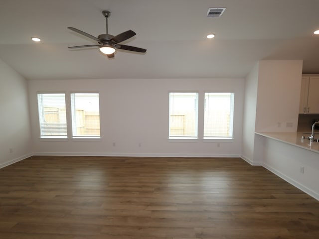 26235 Astral Way, La Marque, TX 77568 - spare room with healthy amount of natural light, ceiling fan, baseboards, dark wood-type flooring, and recessed lighting
