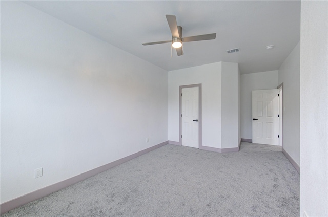 unfurnished bedroom featuring light carpet and ceiling fan