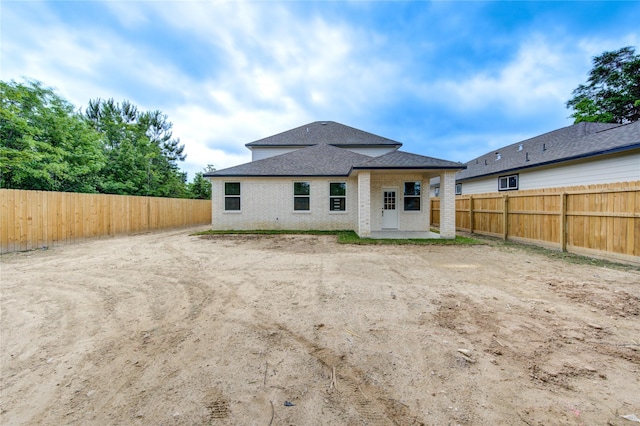 back of house featuring a patio area