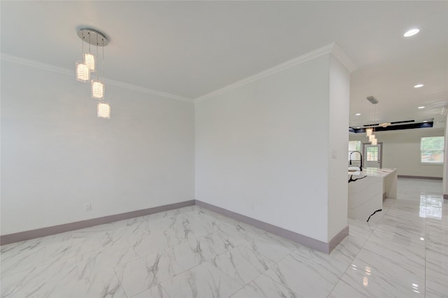 spare room with sink and ornamental molding