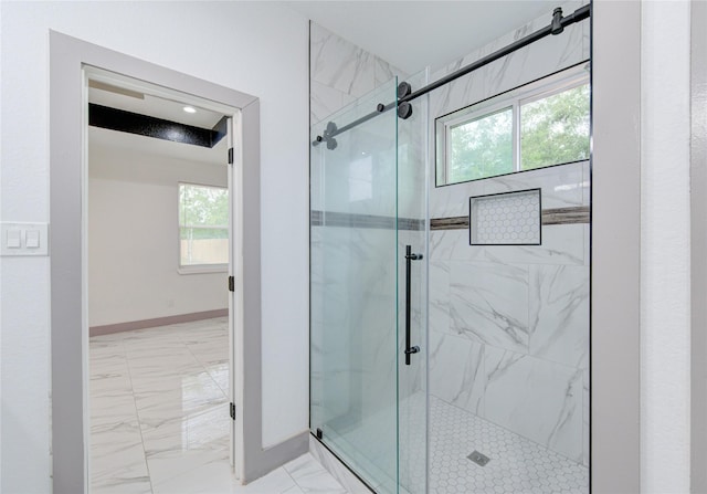 bathroom featuring a healthy amount of sunlight and walk in shower