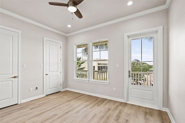 doorway to outside featuring crown molding, light hardwood / wood-style floors, and ceiling fan