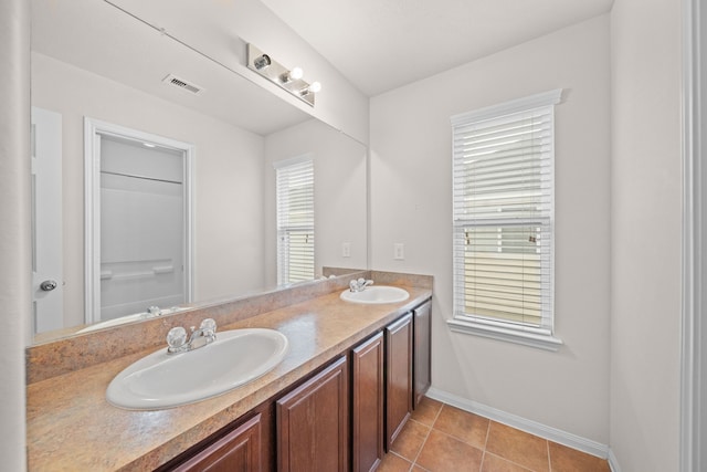 bathroom with tile patterned flooring and vanity