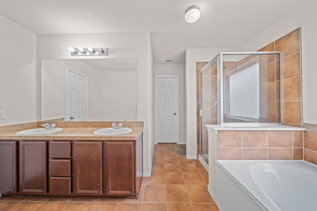 bathroom with vanity, tile patterned floors, and plus walk in shower