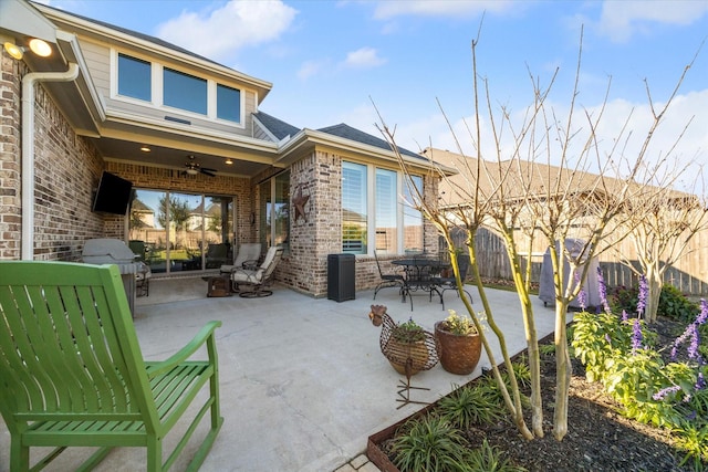 exterior space featuring ceiling fan