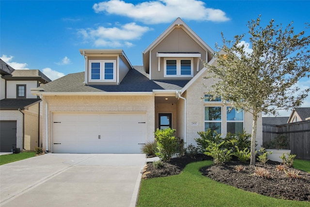 view of front of home featuring a garage, brick siding, driveway, and a shingled roof