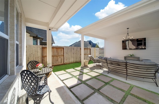 view of patio / terrace with outdoor lounge area and fence