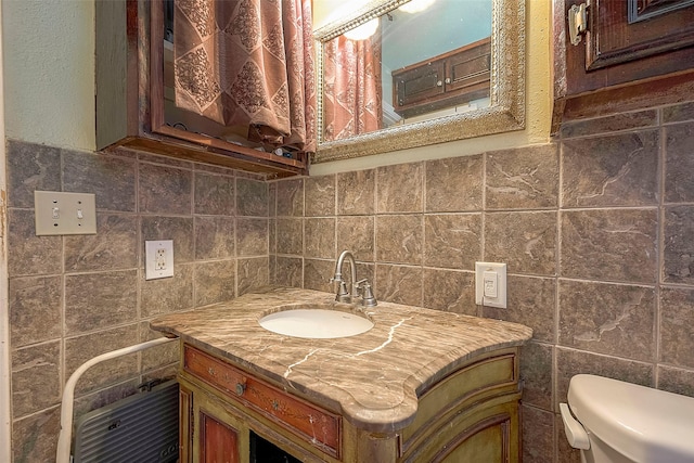 1814 Mansfield St, Houston, TX 77091 - bathroom featuring vanity, tile walls, and toilet