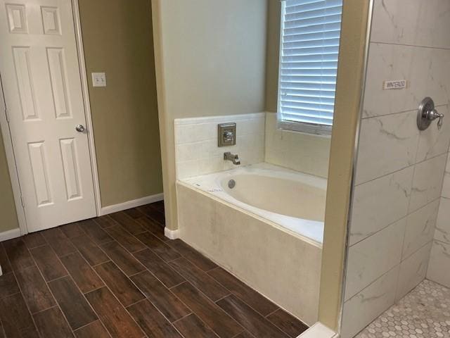 bathroom featuring plus walk in shower