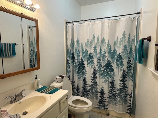 full bathroom featuring a shower with curtain, vanity, toilet, and tile patterned floors