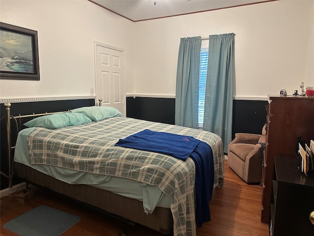 bedroom featuring wood finished floors