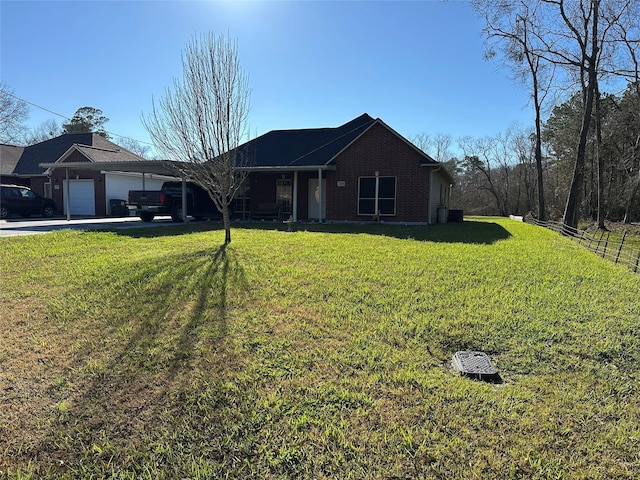 single story home featuring an attached garage, a front yard, concrete driveway, and brick siding