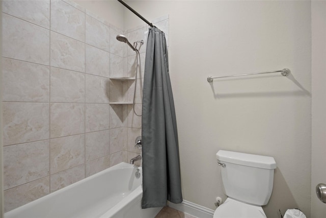 bathroom featuring shower / bath combination with curtain and toilet