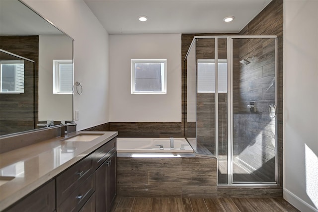 bathroom featuring vanity and plus walk in shower